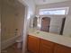 Bathroom with a single sink vanity and a bathtub at 11998 Camden Brook St, Las Vegas, NV 89183