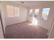 Spacious bedroom with neutral carpet and multiple windows at 11998 Camden Brook St, Las Vegas, NV 89183