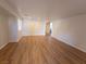 Spacious living room with light wood laminate flooring at 11998 Camden Brook St, Las Vegas, NV 89183