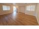 Bright living room with hardwood floors and an open floor plan at 11998 Camden Brook St, Las Vegas, NV 89183