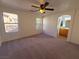 Main bedroom with carpet, ceiling fan and en-suite bathroom at 11998 Camden Brook St, Las Vegas, NV 89183