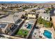 Aerial view of homes with pools and a desert landscape at 165 Arrow Point Ln, Henderson, NV 89011