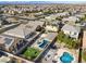 Aerial view of house with pool and landscaped backyard in a residential neighborhood at 165 Arrow Point Ln, Henderson, NV 89011