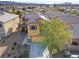 Two-story house with solar panels and a desert landscape background at 165 Arrow Point Ln, Henderson, NV 89011