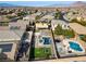 Aerial view showing home with pool, landscaped yard, and solar panels at 165 Arrow Point Ln, Henderson, NV 89011