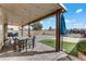 Covered patio with seating area, pavers, and artificial turf at 165 Arrow Point Ln, Henderson, NV 89011