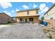 Backyard with covered patio, artificial turf, and a paved patio at 165 Arrow Point Ln, Henderson, NV 89011