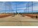 View down the center of a baseball field with benches at 165 Arrow Point Ln, Henderson, NV 89011