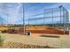 Baseball field with dugouts and chain link fence at 165 Arrow Point Ln, Henderson, NV 89011