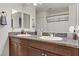 Modern bathroom with double sinks and granite countertop at 165 Arrow Point Ln, Henderson, NV 89011