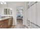 Shared bathroom with double vanity and view of bedroom at 165 Arrow Point Ln, Henderson, NV 89011