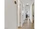 Light and bright hallway with wood-look floors at 165 Arrow Point Ln, Henderson, NV 89011