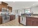 Modern kitchen with granite countertops, stainless steel appliances, and island at 165 Arrow Point Ln, Henderson, NV 89011