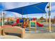 playground with shade structure, slides, and play equipment at 165 Arrow Point Ln, Henderson, NV 89011