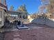 Covered patio, gravel yard, and block wall at 1764 Sunflower Ct, Henderson, NV 89074