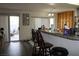 Kitchen features granite countertops and a breakfast bar with two stools at 1764 Sunflower Ct, Henderson, NV 89074