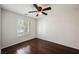 Bedroom with dark hardwood floors and a ceiling fan at 1960 S Vineyard Dr, Pahrump, NV 89048