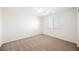 Well-lit bedroom with carpet flooring and window at 1960 S Vineyard Dr, Pahrump, NV 89048