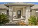 Front entry with stone columns and a decorative door at 1960 S Vineyard Dr, Pahrump, NV 89048