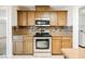 Stainless steel appliances and wood cabinets in this kitchen at 1960 S Vineyard Dr, Pahrump, NV 89048