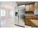 Kitchen with stainless steel refrigerator and wood cabinets at 1960 S Vineyard Dr, Pahrump, NV 89048