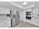 Kitchen features stainless steel appliances and white cabinetry at 1968 Revere Ct, Henderson, NV 89014