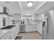 Modern kitchen with stainless steel appliances and white cabinets at 1968 Revere Ct, Henderson, NV 89014