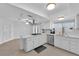 Island kitchen with stainless steel appliances and white cabinetry at 1968 Revere Ct, Henderson, NV 89014