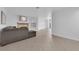 Open living room with tile floors and a view to kitchen at 1968 Revere Ct, Henderson, NV 89014