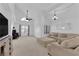 Bright living room featuring a sectional sofa and vaulted ceiling at 1968 Revere Ct, Henderson, NV 89014