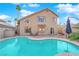 Spacious backyard with a turquoise pool and patio furniture at 1968 Revere Ct, Henderson, NV 89014