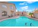 Stunning freeform pool with patio and lounge chairs at 1968 Revere Ct, Henderson, NV 89014