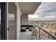 Spacious balcony with city views and seating area at 200 W Sahara Ave # 1012, Las Vegas, NV 89102