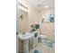 Clean bathroom with pedestal sink and tiled floor at 200 W Sahara Ave # 1012, Las Vegas, NV 89102