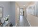 Elegant hallway with light wood floors and modern wall decor at 200 W Sahara Ave # 1012, Las Vegas, NV 89102