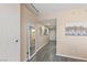 Long hallway with grey flooring and modern decor at 200 W Sahara Ave # 1012, Las Vegas, NV 89102