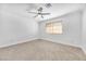 Spacious bedroom featuring a ceiling fan and large window with blinds at 2000 Goldhill Ave, Las Vegas, NV 89106