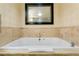 Relax in this bathroom's luxurious soaking tub at 2000 N Fashion Show Dr # 3808, Las Vegas, NV 89109