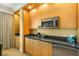 Well-equipped kitchenette with microwave and small refrigerator at 2000 N Fashion Show Dr # 3808, Las Vegas, NV 89109