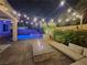 Relaxing backyard with pool, fire pit, and string lights at 201 White Mule Ave, Las Vegas, NV 89148