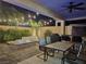 Outdoor patio with seating, fire pit, and built-in BBQ at 201 White Mule Ave, Las Vegas, NV 89148