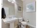 Clean bathroom with pedestal sink and updated fixtures at 201 White Mule Ave, Las Vegas, NV 89148