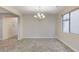 Formal dining room with chandelier and tiled floor at 201 White Mule Ave, Las Vegas, NV 89148