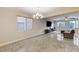 Bright dining room with chandelier and view into living room at 201 White Mule Ave, Las Vegas, NV 89148