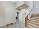 Two-story entryway with staircase and hardwood flooring at 201 White Mule Ave, Las Vegas, NV 89148