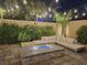 Modern fire pit and seating area in a landscaped backyard at 201 White Mule Ave, Las Vegas, NV 89148