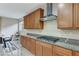 Kitchen features gas cooktop and ample wood cabinets at 201 White Mule Ave, Las Vegas, NV 89148