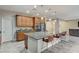 Kitchen island with granite countertop and bar seating at 201 White Mule Ave, Las Vegas, NV 89148