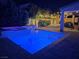 Night view of a luxurious pool and spa with integrated hot tub at 201 White Mule Ave, Las Vegas, NV 89148