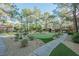 Community courtyard with putting green, landscaping, and walking paths at 2200 S Fort Apache Rd # 1065, Las Vegas, NV 89117